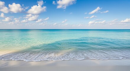 Tranquil ocean scene with turquoise waves lapping against a pristine white sand beach. Fluffy clouds fill the serene sky, creating a peaceful tropical escape. An invitation to relax and unwind.