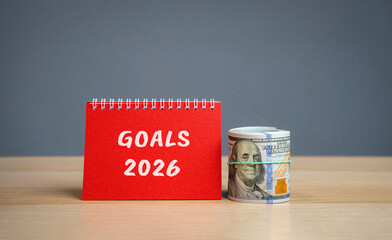 Financial planning, plans and tasks. Startup and achievements. Setting goal. Motivation, inspiration. Notes with words Goals 2026 and dollars money.
