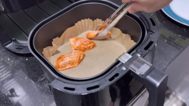 Start Deep frying BBQ chicken wings using a deep fryer