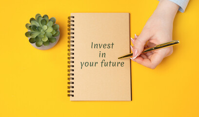 Notes Invest in your future concept. Financial growth, smart planning, and new opportunities. Real estate, business, investment, and motivational. Woman writing in a notepad