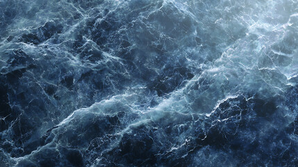Obraz premium Deep ocean waves with swirling white foam and dark blue water image