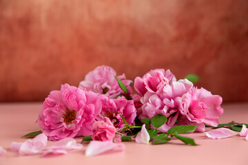 Thank you card among pink flowers on a pastel background