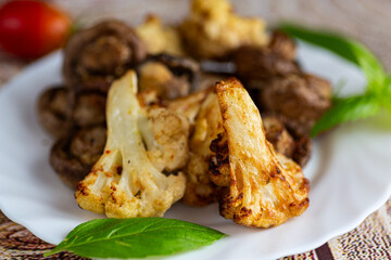 Homemade lunch with roasted cauliflower florets and mushrooms