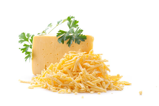 Grated cheese and cheese block with parsley on white background
