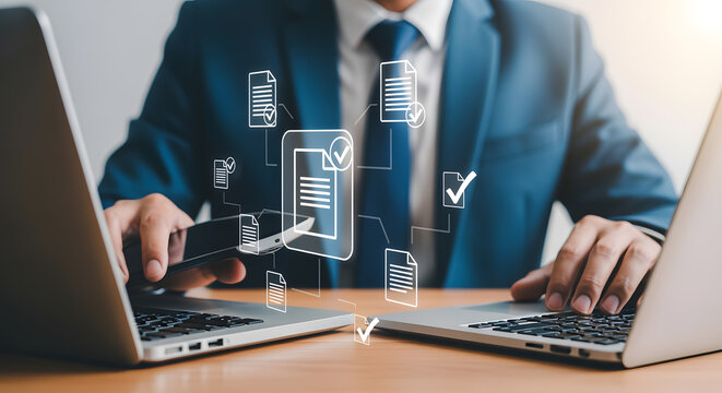 Professional businessman managing digital documents and tasks efficiently on laptops, streamlining workflow with modern technology for success