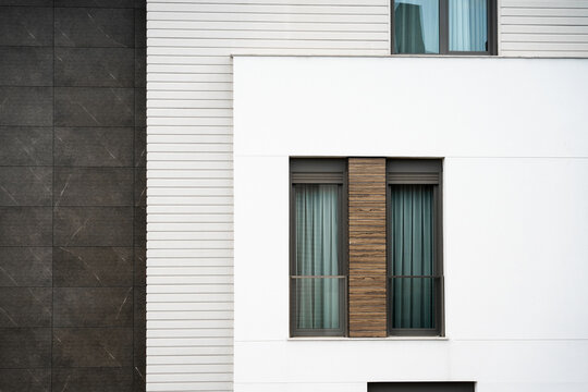 window with shutters in modern white brown building design architecture 