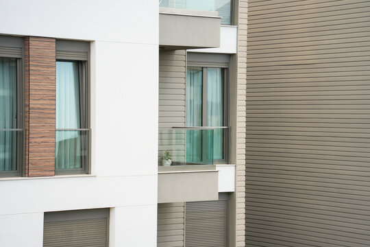 window with shutters in modern white brown building design architecture 