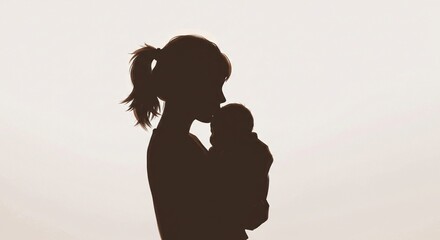 Silhouette of a mother holding her baby against a bright, hazy sky