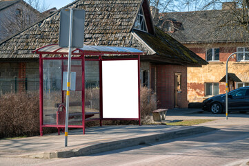 Mock-up of blank billboard at bus stop in urban area showcasing advertisement space
