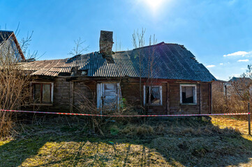 Old wooden house in Valdemarpils, Latvia under clear blue sky during daytime