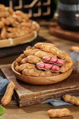 Fresh Raw Peanuts with Red Shelled Nuts in Wooden Bowl on Rustic Kitchen Counter