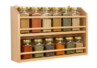 Isolated wooden spice rack with glass jars and gold lids filled with assorted spices