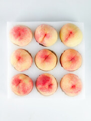 Fresh Yangshan Peaches from Wuxi China Arranged on White Background - Premium Stone Fruit Display