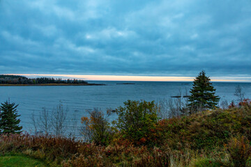 Serene sunrise over the St Lawrence River near Metis-sur-Mer, Quebec, capturing the tranquil beauty of the Canadian landscape.