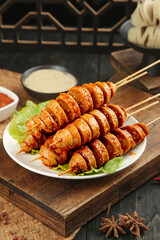 Big Spicy Handmade Gluten Skewers from Shaanxi China on Wooden Board with Sauce