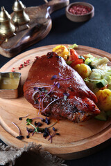 Baked pork knuckle with cabbage and potatoes. Oktoberfest menu. Knuckle for beer. Traditional German cuisine