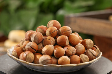 Fresh Handpeeled Hazelnuts in Bowl - Natural Dried Nuts and Kernels on Rustic Kitchen Table