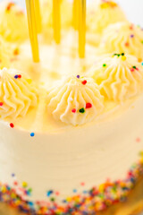 Close view of birthday cake frosting and candles
