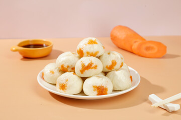 Traditional Shengzhou Xiao Long Bao Dumplings with Carrot Filling and Tangy Sauce