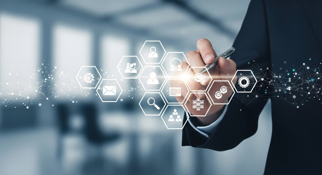 A businessman's hand interacts with holographic technology, showcasing digital icons and symbols, representing innovation and future business strategies.