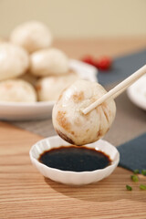 Traditional Shengzhou Xiaolongbao Soup Dumplings with Fresh Meat and Soy Sauce - Chinese Cuisine