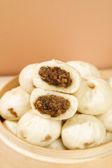 Traditional Shengzhou Xiaolongbao Chinese Steamed Buns with Meat Filling in Bamboo Steamer