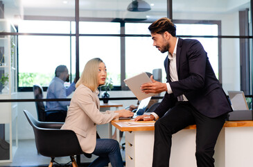 business man woman manager in formal suit discuss market share with colleague coworker at finance office, employee team meeting collaborate on progress brainstorm spread idea working together