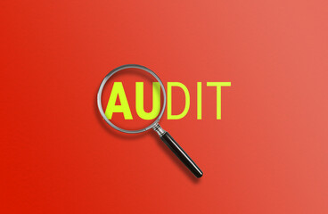 A magnifying glass focuses on AUDIT against a red background 
