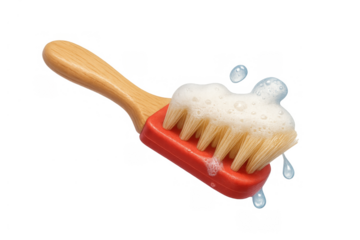 Cleaning brush having soap foam and water drops, scrubbing tool for hygiene and domestic chores on transparent background