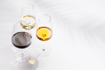 Naklejka premium Different wine glasses on white background