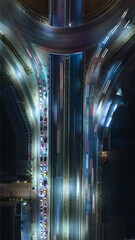 Expressway top view, Road traffic an important infrastructure, car traffic transportation above intersection road in city night, aerial view cityscape of advanced innovation, financial technology