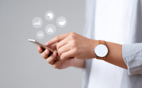 Focused hand using phone with app icon for business communication and network technology concept. Person with smartwatch managing modern digital lifestyle