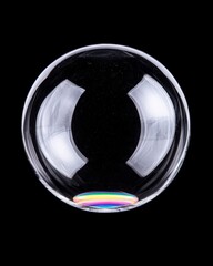 Transparent Soap Bubble with Rainbow Reflection on Black Background