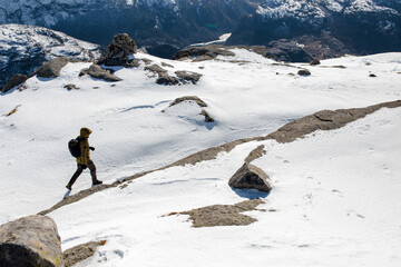 Hiker on Snowy Mountain Trail