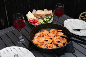 fried king prawns in a frying pan on the fire