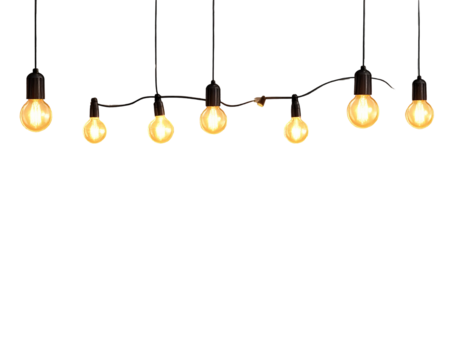 A string of vintage Edison light bulbs hanging against a white background.