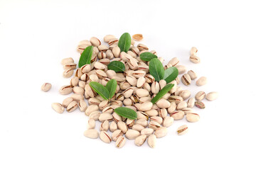 Pistachios spilled out on white background