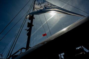 Albanian flag on yacht mast rigging against the sky