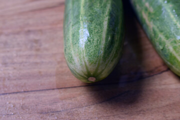 fresh green cucumber on table close up