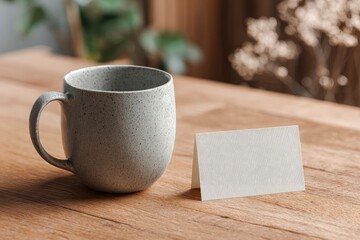 Mug and card on wood table