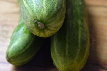 fresh green cucumber on table close up