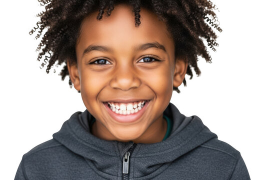 Joyful young boy with curly hair smiling brightly in a hoodie transparent background