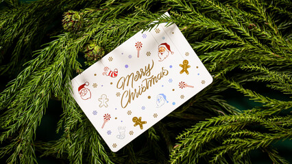 white Merry Christmas greeting card on christmas tree branches, greeting card on fir branches...