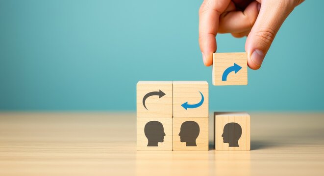 Wooden blocks with head icons and arrows for business process teamwork strategy management communication concept solution idea