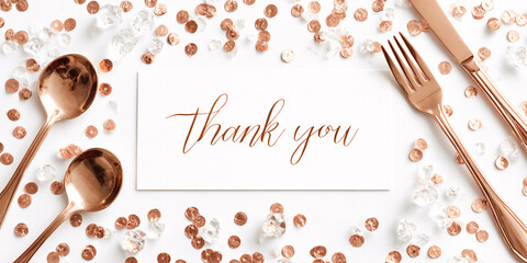 Elegant Thank You card with rose gold cutlery and confetti on white background Festive flat lay for celebrations, events, and gratitude