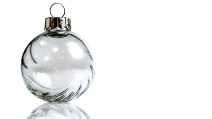 Elegant clear glass Christmas ornament reflecting soft light isolated on white background
