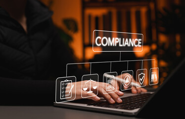 Corporate compliance concept. Person using laptop with icons of checklist, law scale, policy, legal, shield, represent regulatory standards, risk management, governance, organizational accountability,