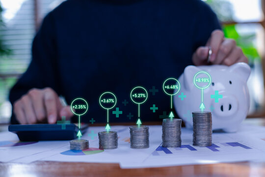 Stacked coins with growth percentage icons and piggy bank in background, symbolizing financial investment, profit increase, saving strategy, business growth concept for finance and economic success. - Powered by Adobe