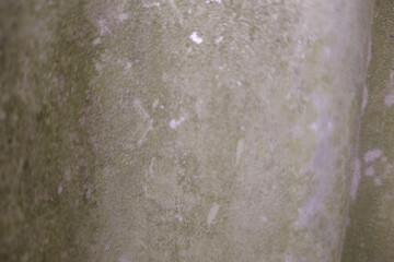 Close up texture of weathered concrete surface with subtle variations in tone and light