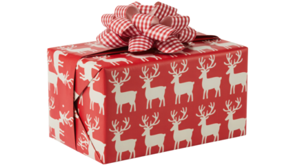 Festive red christmas gift box wrapped in paper adorned with white reindeer pattern and topped with a large red and white checkered ribbon bow isolated on transparent background